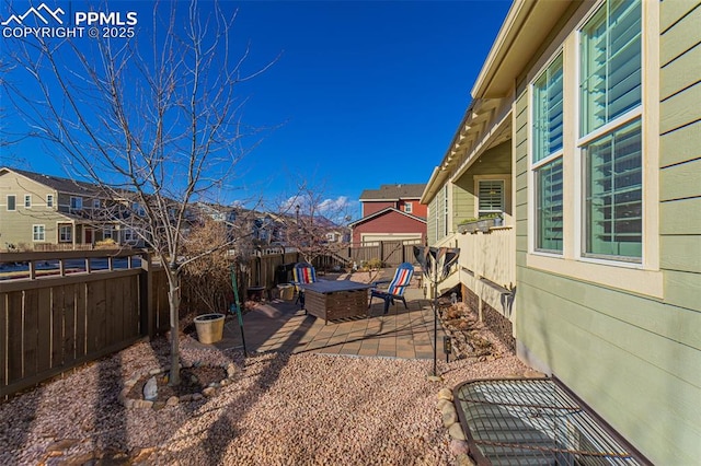 view of yard with a patio area and a fire pit