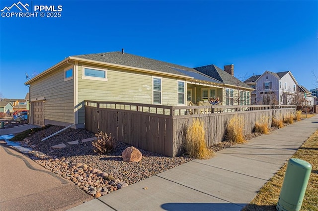 view of side of property with a garage