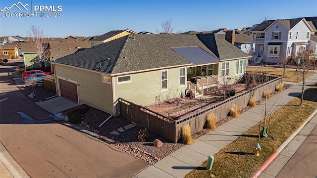 back of house featuring a garage