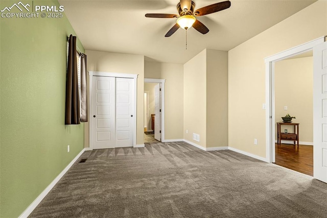 unfurnished bedroom with carpet floors and ceiling fan