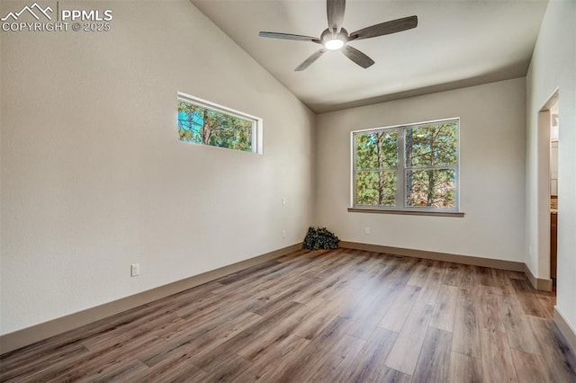 unfurnished room featuring a wealth of natural light, ceiling fan, light hardwood / wood-style floors, and lofted ceiling