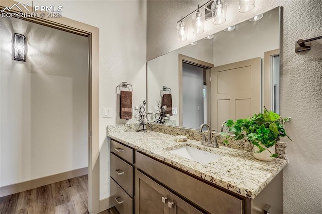 bathroom featuring wood-type flooring and vanity