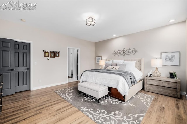 bedroom with hardwood / wood-style flooring