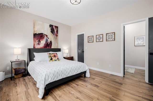 bedroom with light hardwood / wood-style flooring