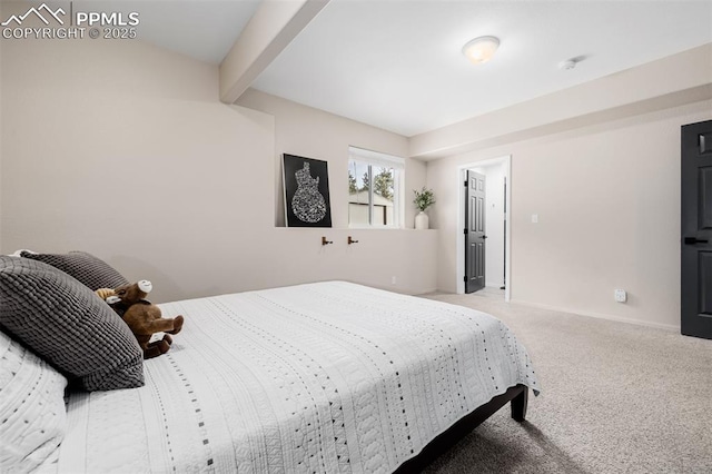 bedroom featuring beam ceiling and carpet floors