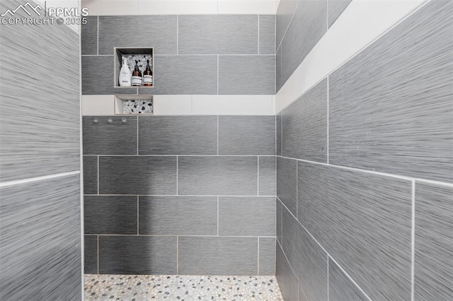 bathroom with tiled shower