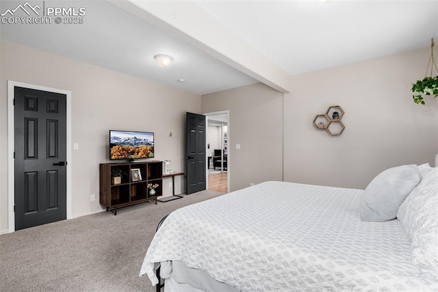 carpeted bedroom with beam ceiling