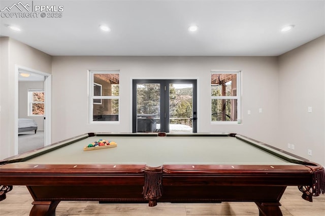 game room featuring french doors, light hardwood / wood-style floors, and billiards