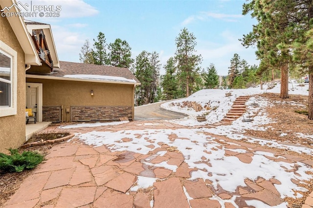 view of snow covered patio