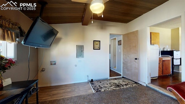 interior space with ceiling fan, wooden ceiling, lofted ceiling with beams, dark hardwood / wood-style floors, and electric panel