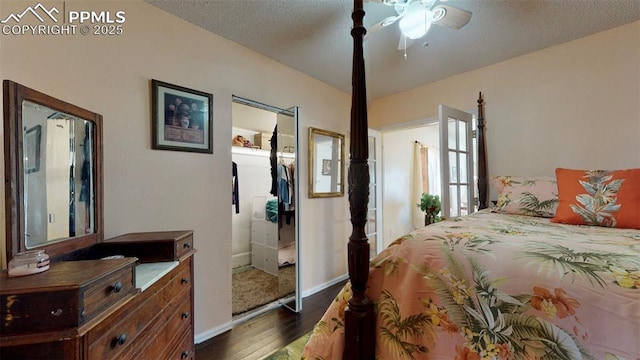 bedroom with ceiling fan, dark hardwood / wood-style flooring, and a textured ceiling