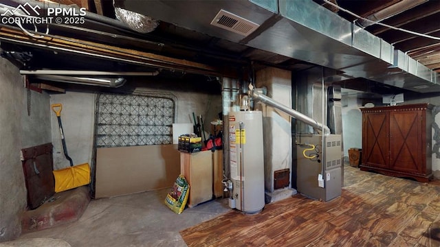 basement with gas water heater and heating unit