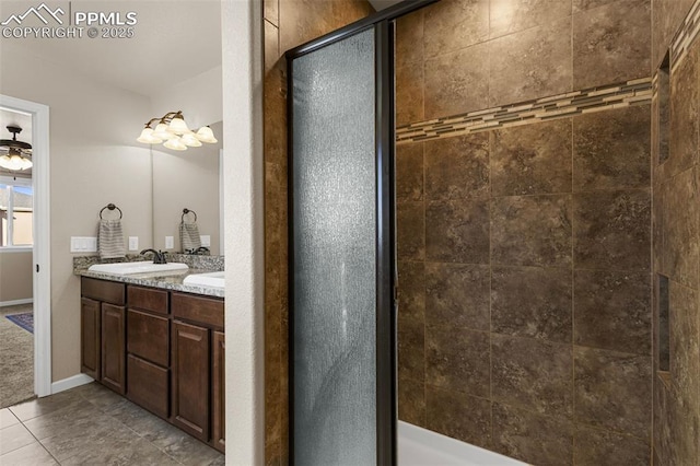 bathroom with tile patterned floors, vanity, and walk in shower