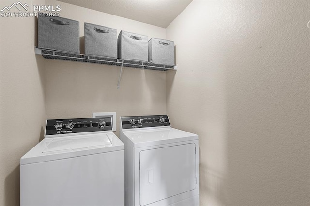 laundry room with washing machine and clothes dryer