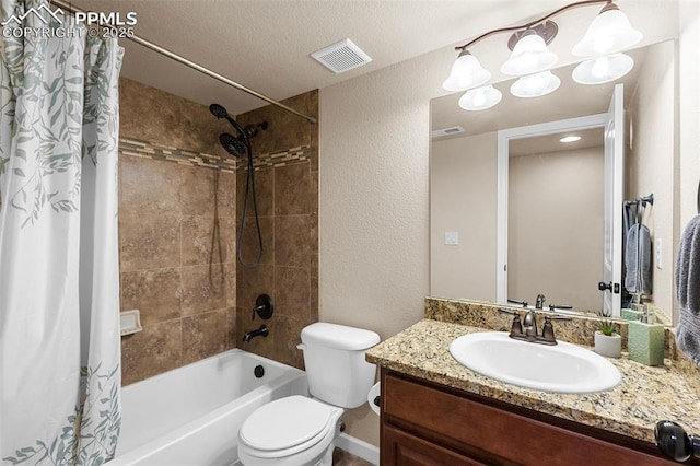 full bathroom featuring vanity, toilet, shower / bathtub combination with curtain, and a textured ceiling