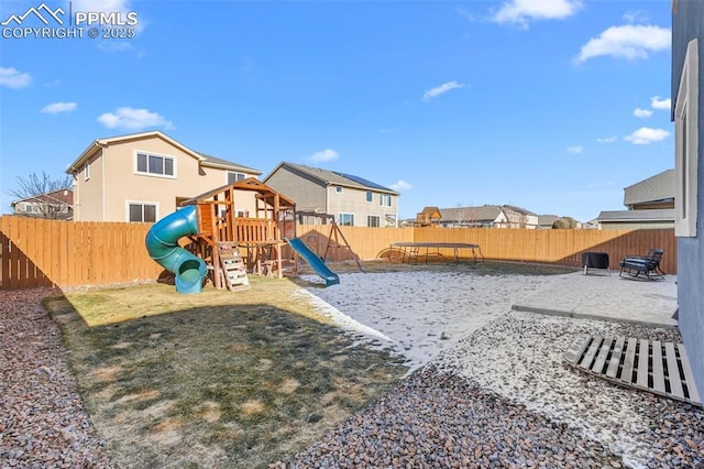 view of jungle gym with a patio area and a trampoline