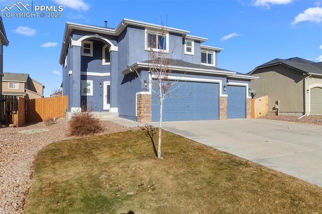 front facade with a front yard and a garage