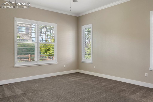 carpeted spare room featuring crown molding and ceiling fan