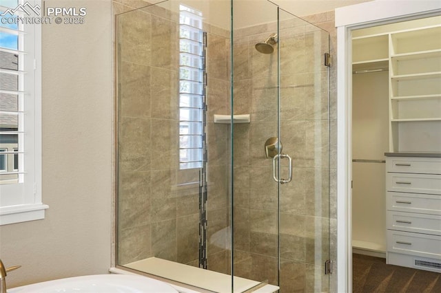 bathroom with a shower with shower door