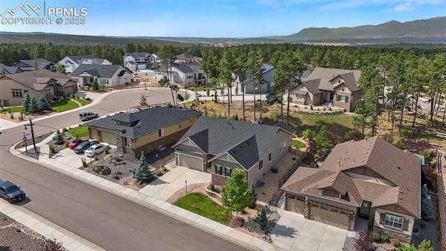 drone / aerial view featuring a mountain view