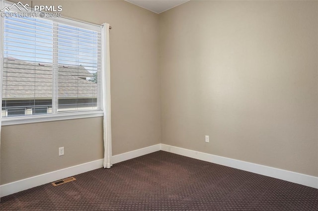 empty room featuring carpet flooring