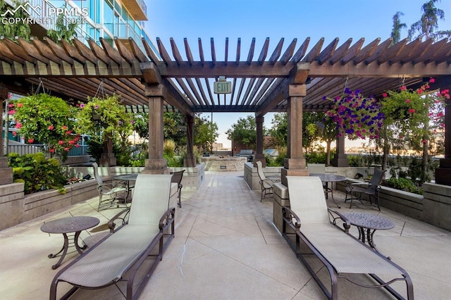 view of property's community featuring a pergola and a patio