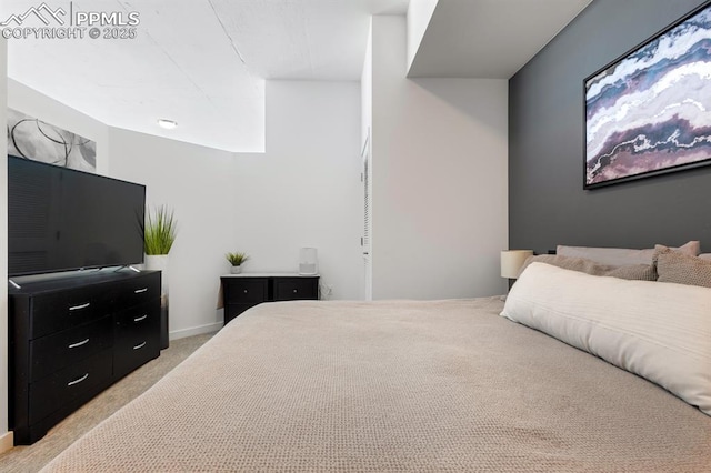 bedroom with light colored carpet