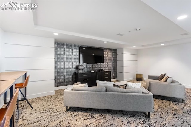 living room with a tray ceiling