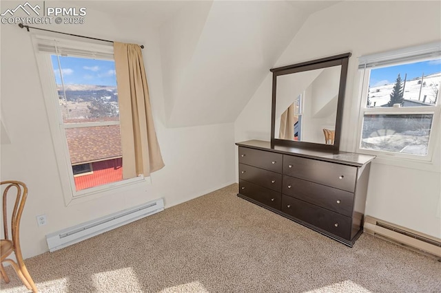 bedroom featuring carpet, vaulted ceiling, and a baseboard heating unit