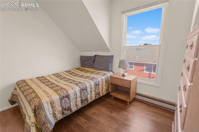 bedroom featuring wood-type flooring and baseboard heating