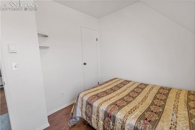 bedroom featuring dark hardwood / wood-style floors