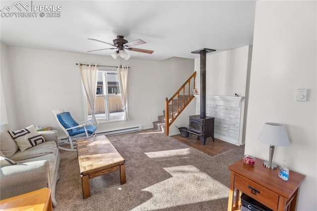 carpeted living room featuring ceiling fan and a wood stove