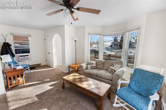 living room with carpet flooring, ceiling fan, and cooling unit