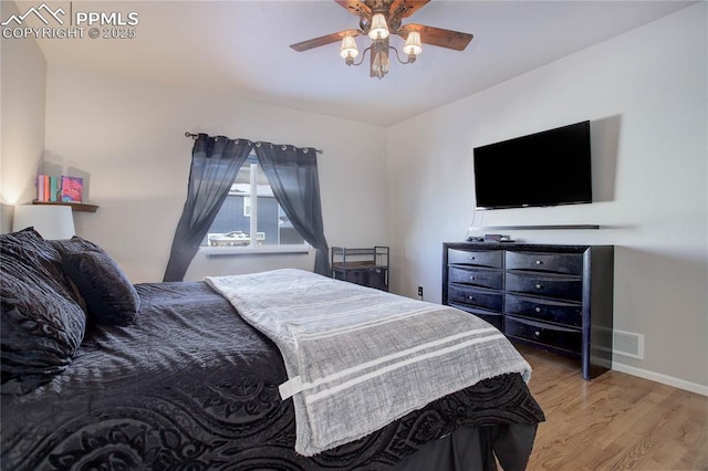 bedroom with light wood-type flooring and ceiling fan