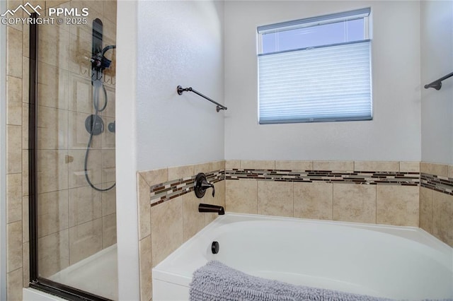 bathroom with separate shower and tub