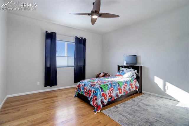 bedroom featuring ceiling fan and wood-type flooring