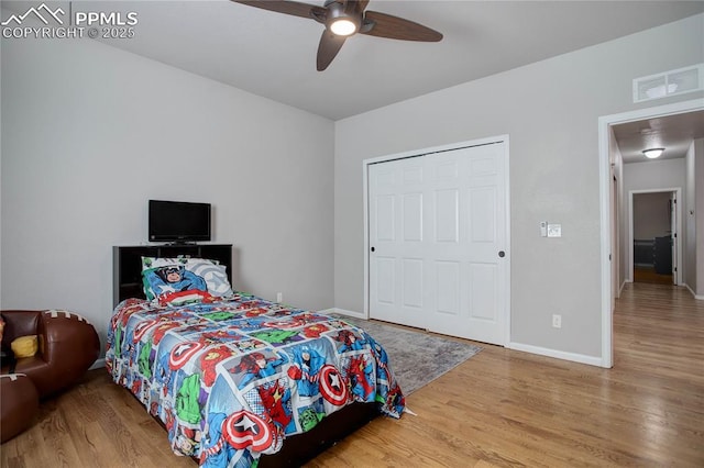 bedroom featuring hardwood / wood-style floors and ceiling fan