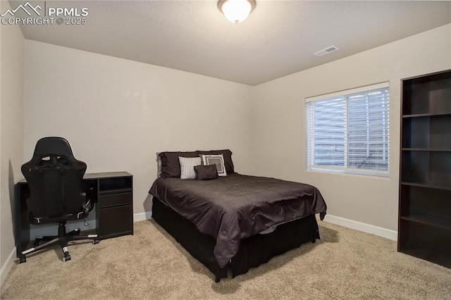 bedroom with light carpet