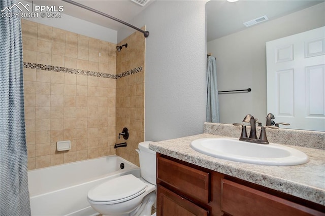 full bathroom featuring vanity, shower / bath combination with curtain, and toilet