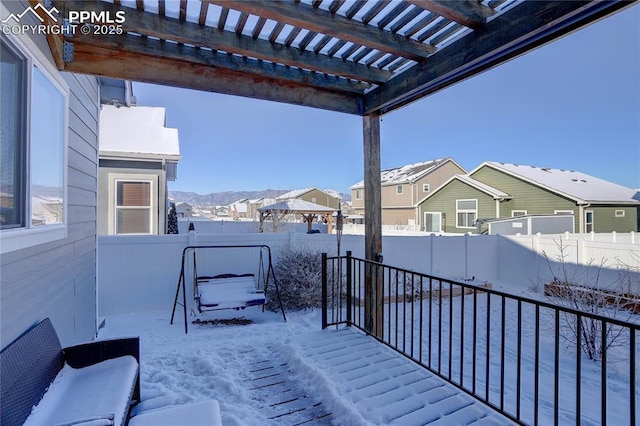 snow covered patio featuring a pergola