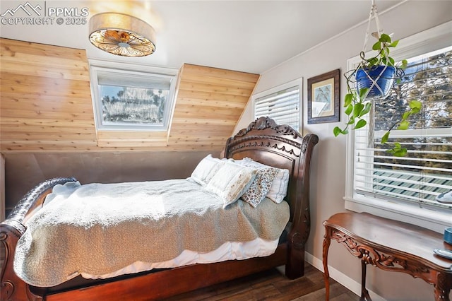 bedroom featuring wooden walls and hardwood / wood-style floors