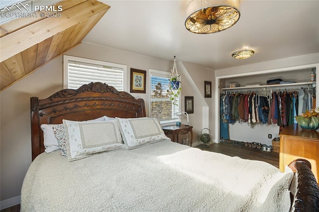 bedroom featuring vaulted ceiling, a closet, and wooden ceiling