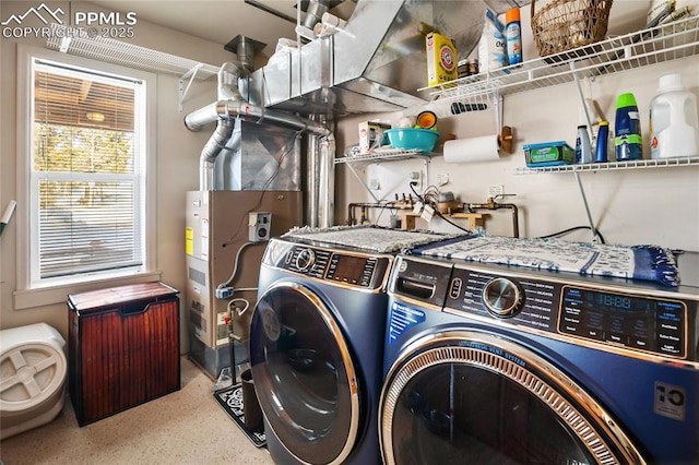 washroom featuring washing machine and dryer