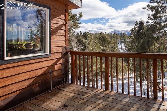 view of snow covered deck