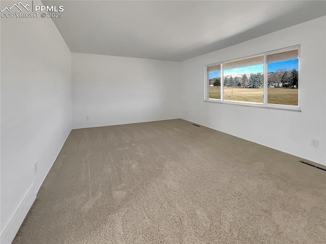 empty room with carpet flooring