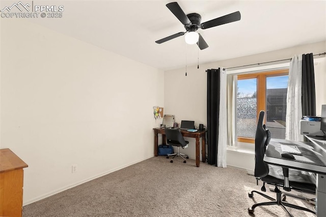 office space featuring ceiling fan and light carpet