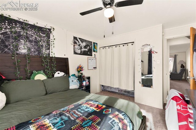 carpeted bedroom with ceiling fan