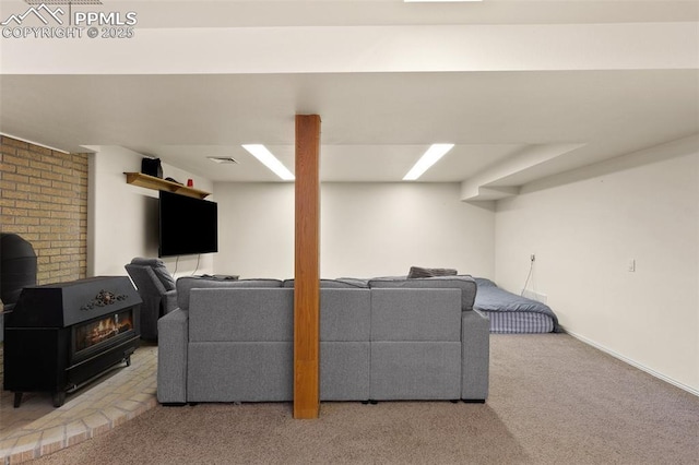 living room with carpet and a wood stove