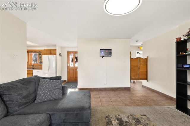 living room featuring tile patterned flooring and sink