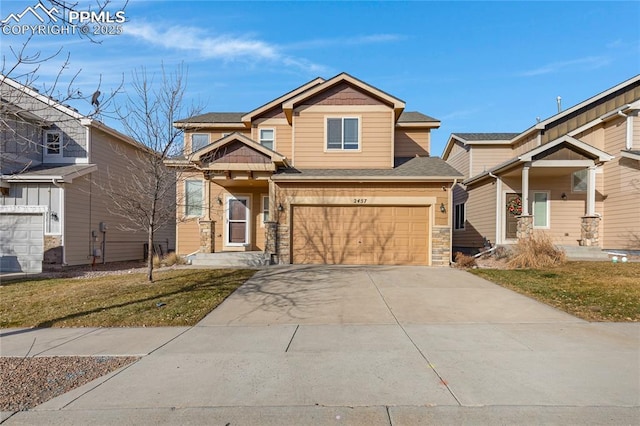 craftsman-style house with a garage and a front lawn